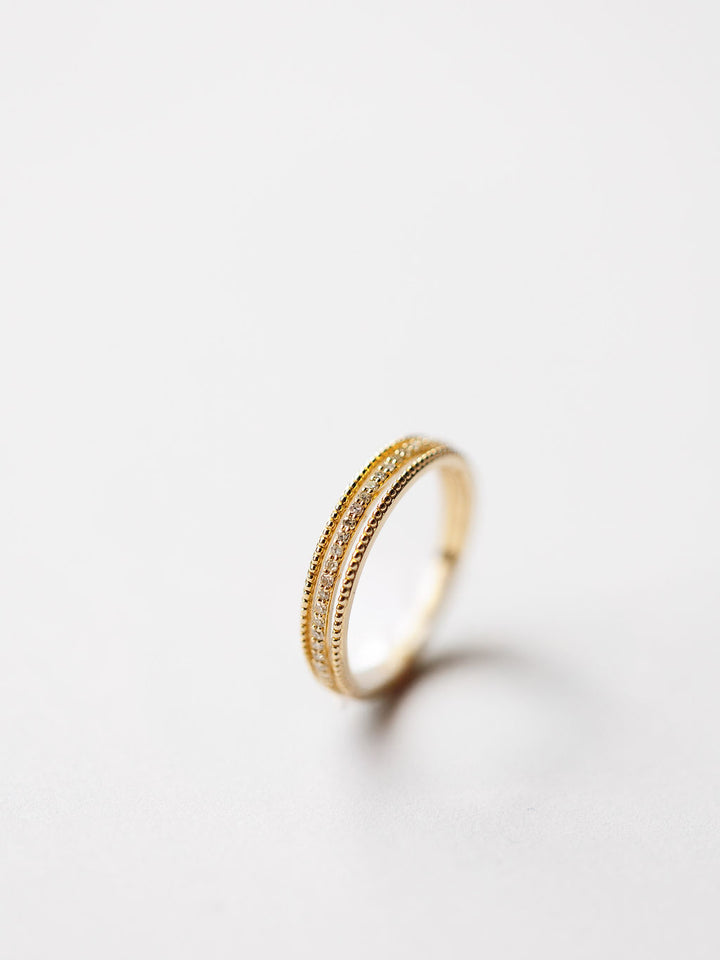 The Diamond Milgrain Ring by Savannah Sevens western life{&}style features a double band design in 14K gold with fine milgrain detailing, shown upright against a plain white background.