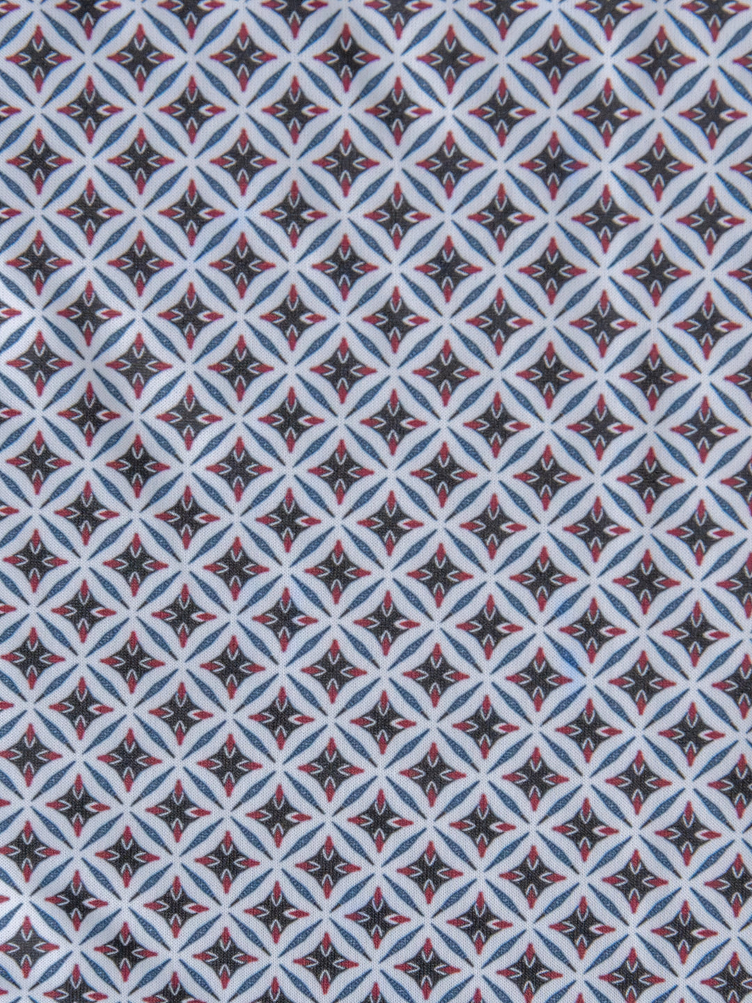 The Lyman {Men's} by Savannah Sevens western life{&}style features a geometric diamond pattern with black backgrounds, white borders, blue crossing lines, and small red center accents—creating a bold, symmetrical look.