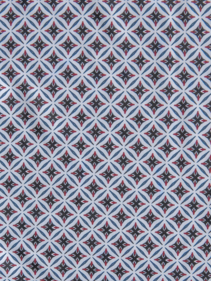 The Lyman {Men's} by Savannah Sevens western life{&}style features a geometric diamond pattern with black backgrounds, white borders, blue crossing lines, and small red center accents—creating a bold, symmetrical look.