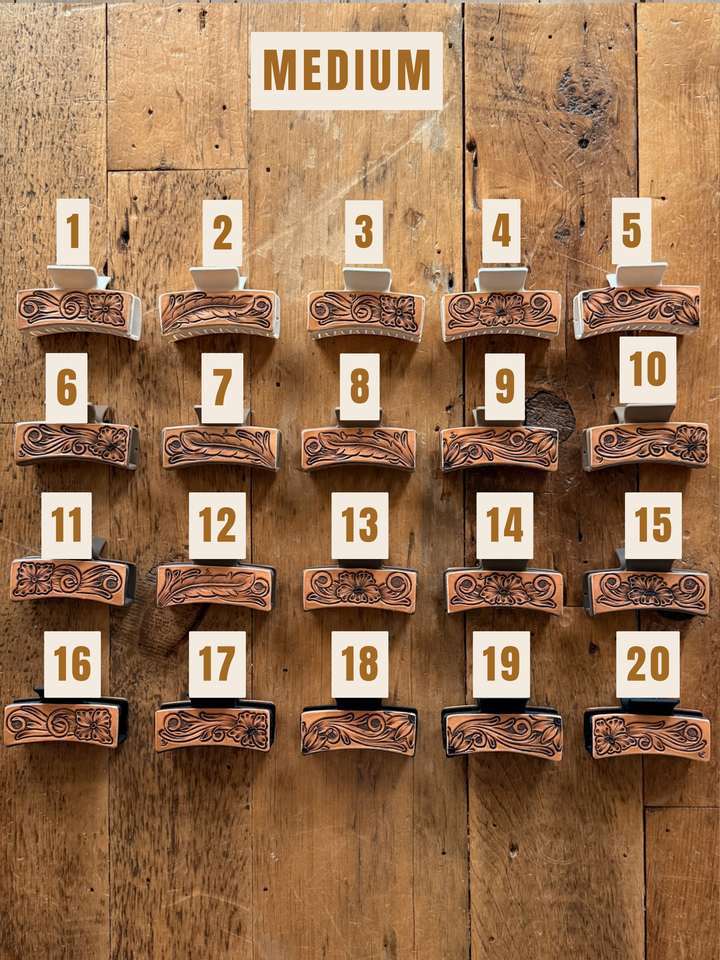 Twenty Campitos Claw Clip accessories arranged in a numbered grid, featuring medium-sized, heavy-duty clips with hand-tooled floral leather designs.