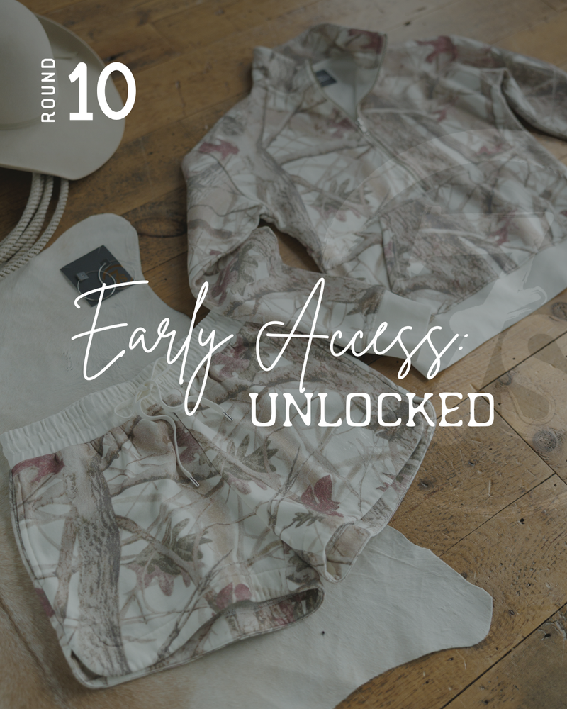 A matching camo-patterned jacket and shorts are laid out on a wooden floor with a white hat and rope beside them. Text over the image reads, ROUND 10 - Early Access: UNLOCKED. The camo adds an adventurous touch to this stylish set.