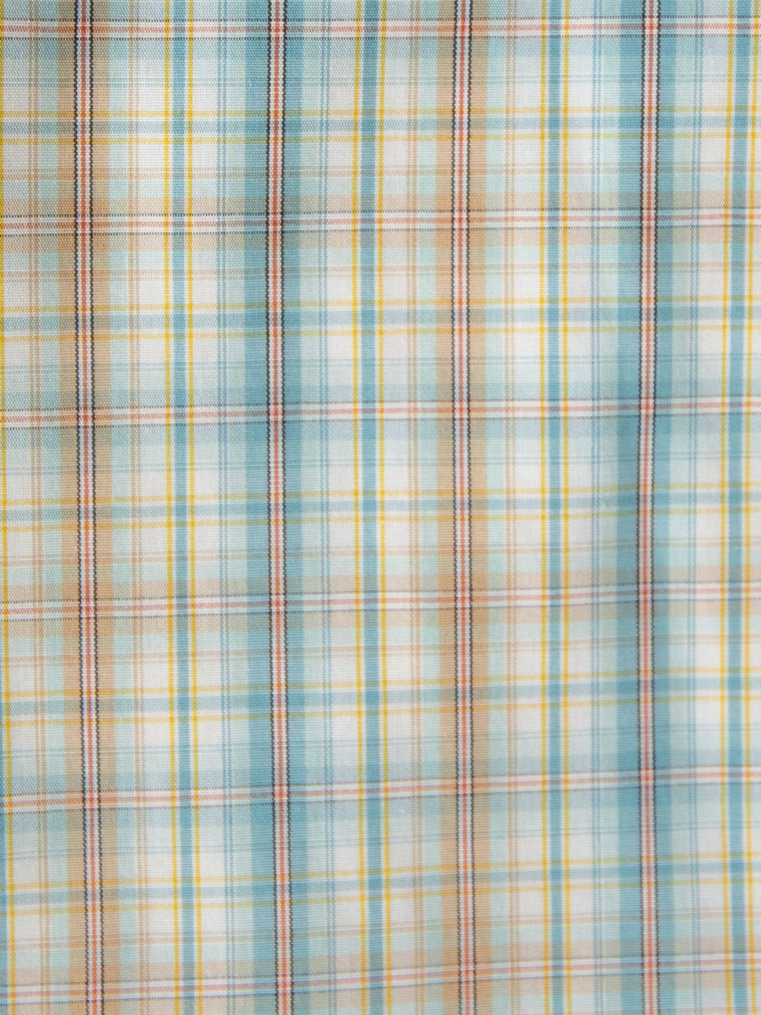The Bowmont Men's Ariat Plaid Button Up from Savannah Sevens western life{&}style features intersecting blue, yellow, red, and white lines in soft pastels for a light, airy look on wrinkle-free cotton.
