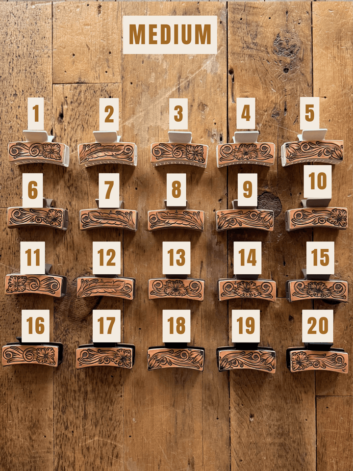 Twenty Campitos Claw Clip accessories arranged in a numbered grid, featuring medium-sized, heavy-duty clips with hand-tooled floral leather designs.