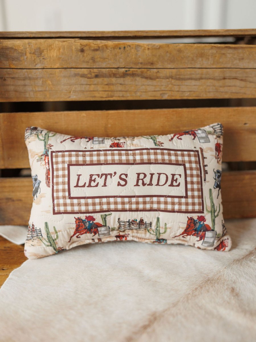 The Cowgirl Gingham Collection pillow by Savannah Sevens western life{&}style features cowboy rodeo-themed fabric, a vintage gingham border, and LETS RIDE on the front—perfect for your western bag collection or rustic décor.
