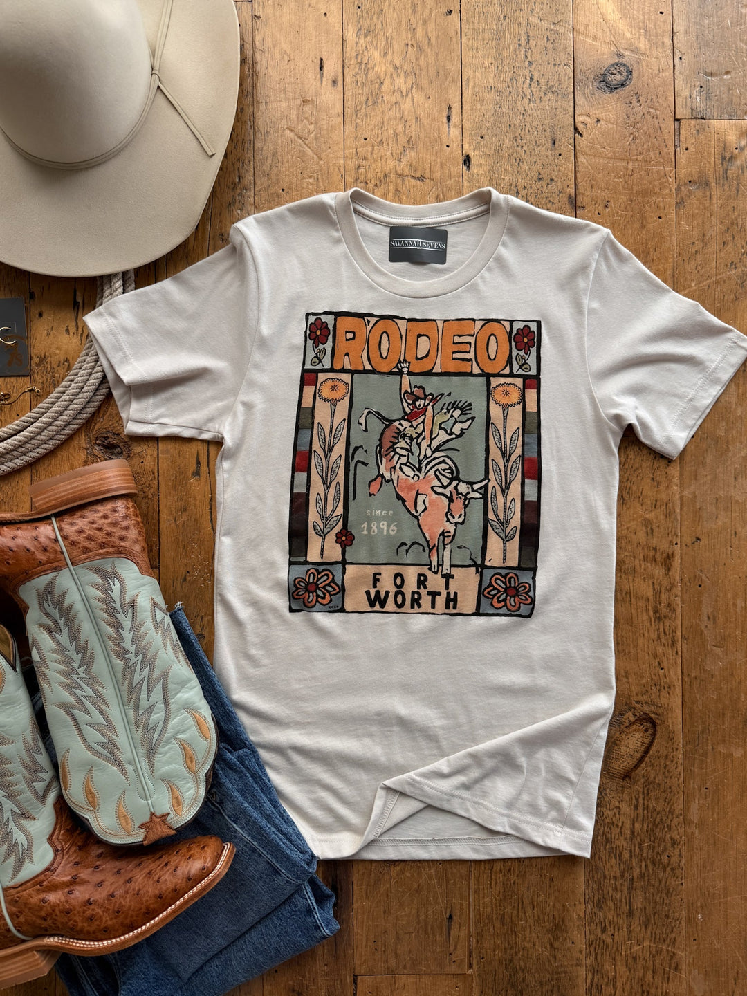 Fort Worth Graphic Tee featuring a stylized illustration of a cowboy riding a bucking bull, with the text Rodeo, Since 1896, and Fort Worth.