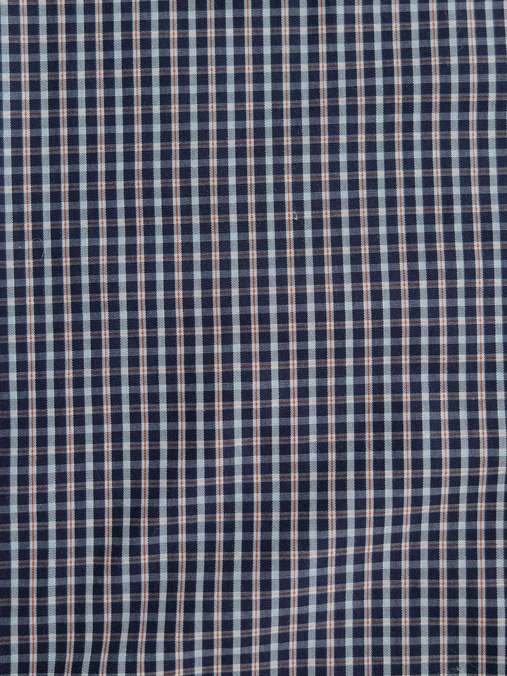 Close-up of the Freeman Ariat Men's Navy Plaid Pearl Snap by Savannah Sevens western life{&}style, featuring a navy background with white and light blue plaid checks, fine lines, and a slightly textured surface.