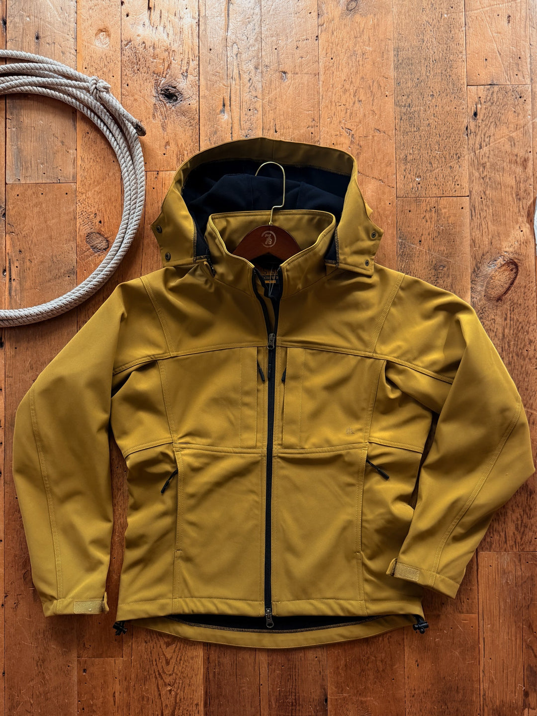 Savannah Sevens western life&style Hastings Golden Tan Softshell Jacket in golden tan with a detachable hood, a black front zipper, and a fleece-lined interior.