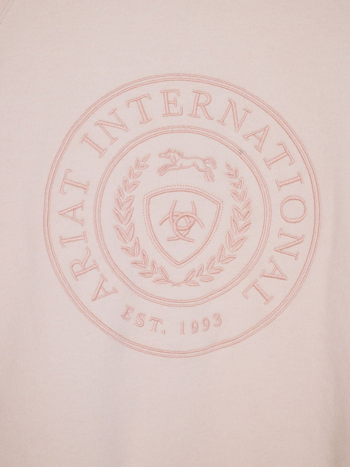 The Lynwood Ariat Light Pink Pullover by Savannah Sevens western life{&}style is crafted from organic cotton, fleece lined, and features a circular embossed ARIAT INTERNATIONAL EST. 1993 emblem with a horse, laurel wreath, shield, horseshoe & horses’ heads.