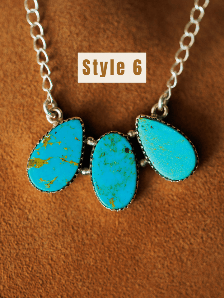 The Montrose Necklace by Savannah Sevens western life{&}style features three Red River Turquoise stones in teardrop and oval shapes, set in sterling silver and displayed on brown suede. The label Style 6 is shown above.