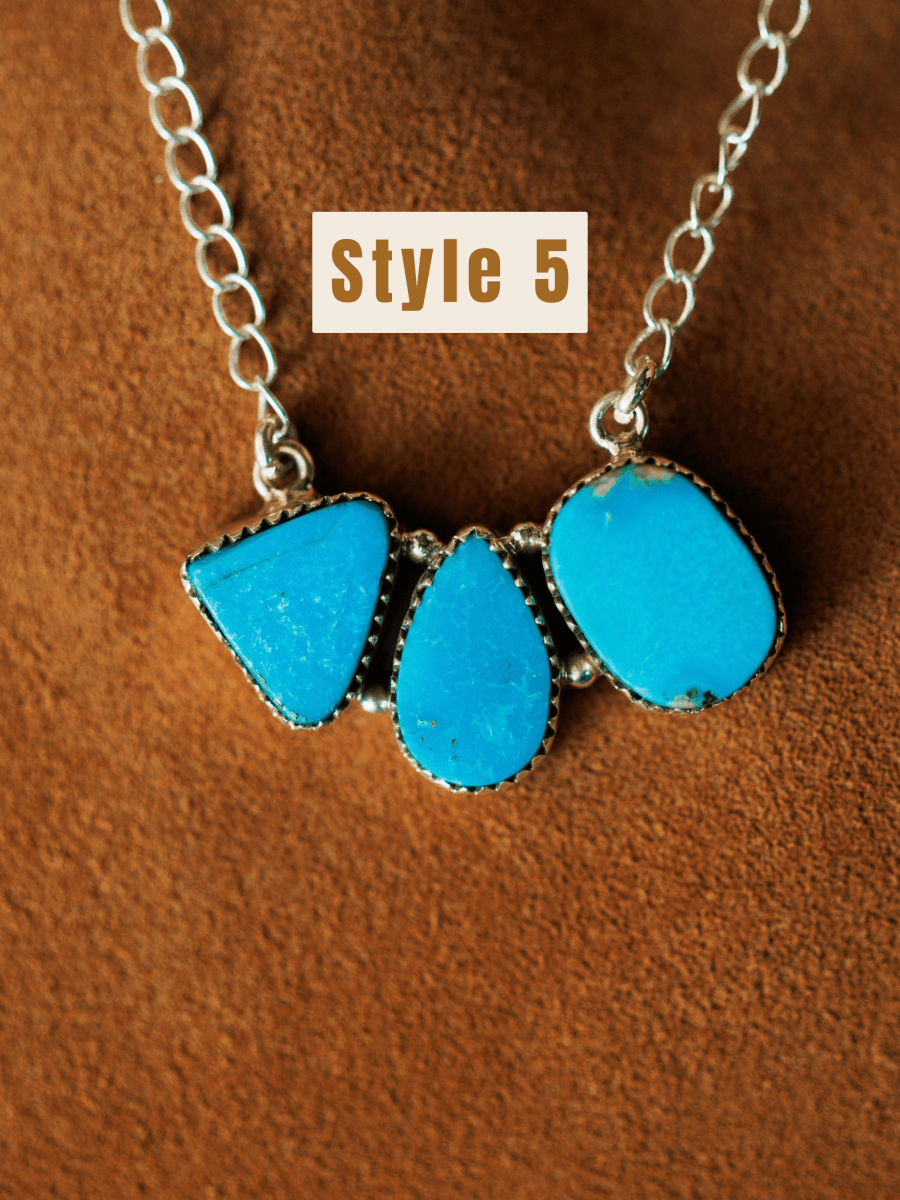 The Montrose Necklace by Savannah Sevens western life{&}style features three large Red River Turquoise stones in unique shapes on brown suede. "Style 5" appears in bold above the necklace.