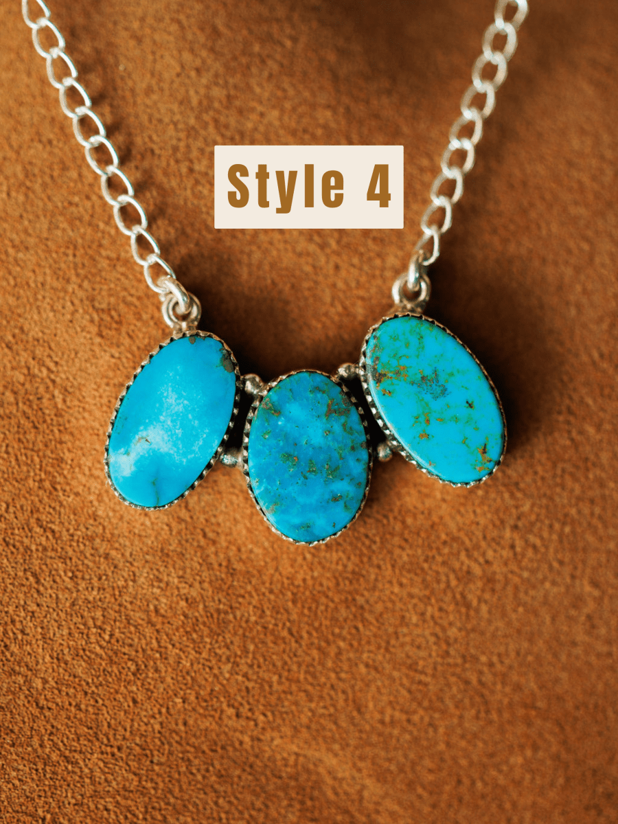 The Montrose Necklace by Savannah Sevens western life{&}style, featuring three oval Red River Turquoise stones set in sterling silver, is displayed on a brown suede surface with "Style 4" in bold above it.