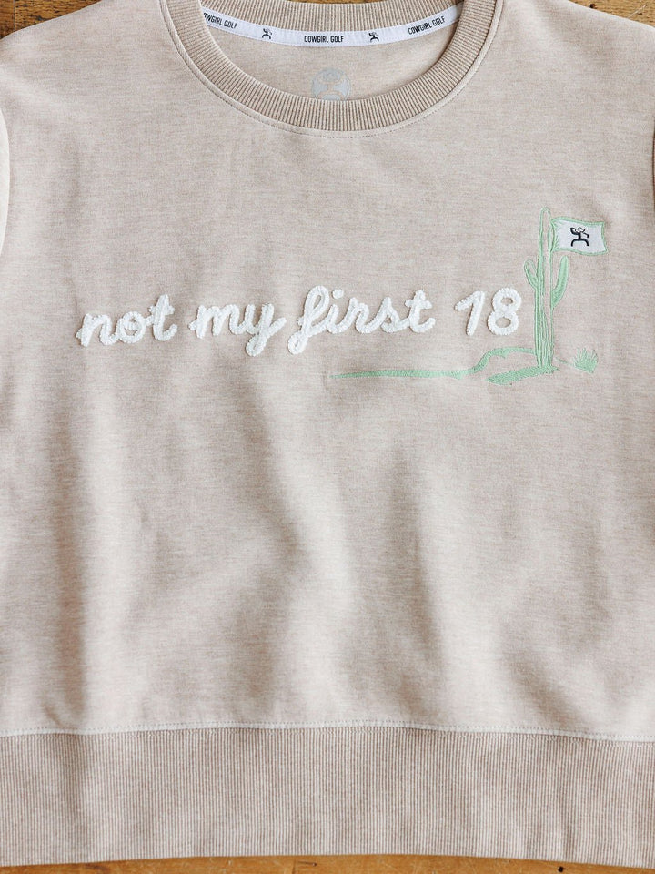 The Not My First 18 oatmeal long sleeve pullover by Savannah Sevens western life{&}style features a relaxed fit and white "not my first 18" embroidery beside a green cactus holding a flag with a stick figure. Sizes S-XXL.