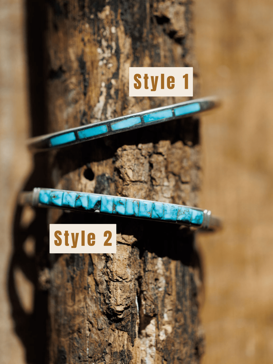 Two Ponderosa Cuff bracelets by Savannah Sevens western life{&}style are shown vertically on textured wood with a blurred wood background. Style 1 (top) and Style 2 (bottom) feature turquoise inlay on sterling silver.