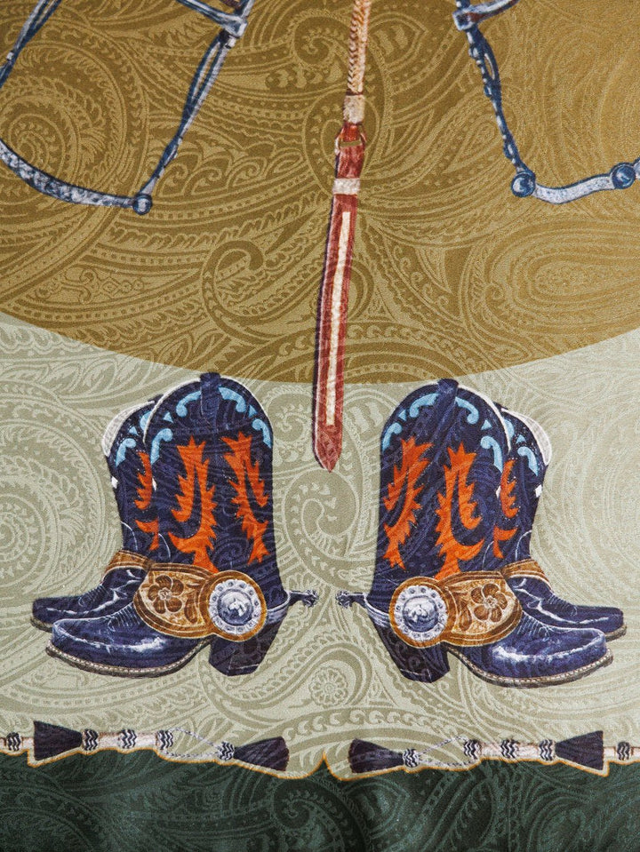 Illustration of decorated cowboy boots with spurs and an ornate belt above, set on a green and brown paisley backdrop, inspired by the luxury Ranch Gear Wild Rag from Savannah Sevens western life{&}style.