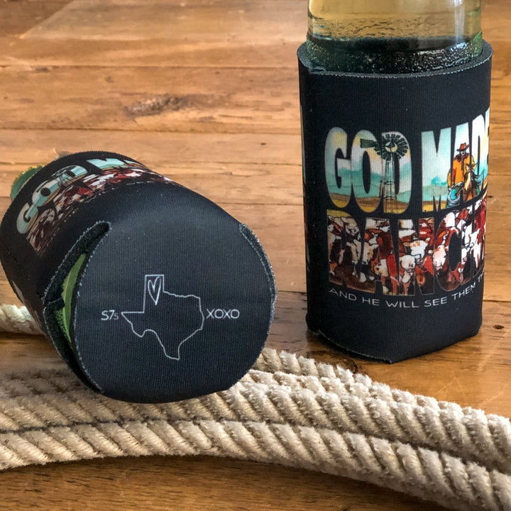 Two Rancher Koozies from Savannah Sevens western life{&}style, one with "GOD MADE" and cowboy art, the other a fundraiser with Texas outline, S7s, and XOXO, rest on wood next to a coiled rope.