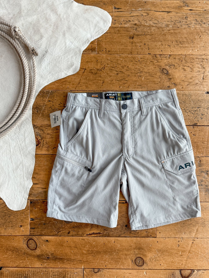 Rockville Ariat Men's M5 Shorts by Savannah Sevens western life{&}style, in light gray with multiple pockets and Durastretch fabric, are laid flat on a wooden floor near a light rug and coiled rope.