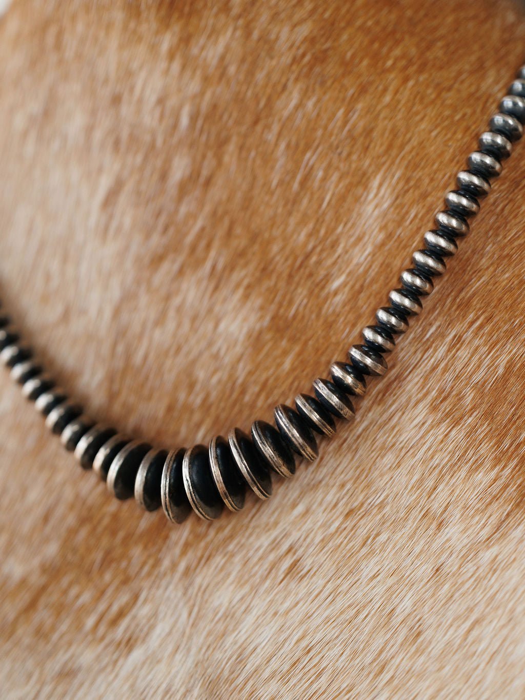 Sarita Graduated Navajo Pearl Necklace featuring a graduated strand of round, darkened sterling silver beads.
