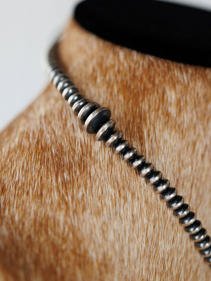Sarita Graduated Navajo Pearl Necklace in sterling silver displayed on a mannequin.