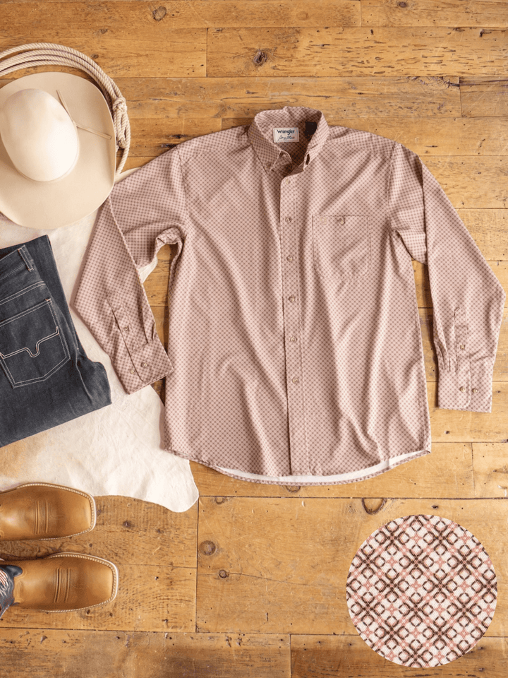 A Strait Wrangler Men's Performance Button Up from Savannah Sevens western life{&}style is displayed on a wooden floor, accompanied by a beige cowboy hat, dark jeans, brown boots, and a close-up highlighting the shirt’s fabric pattern.