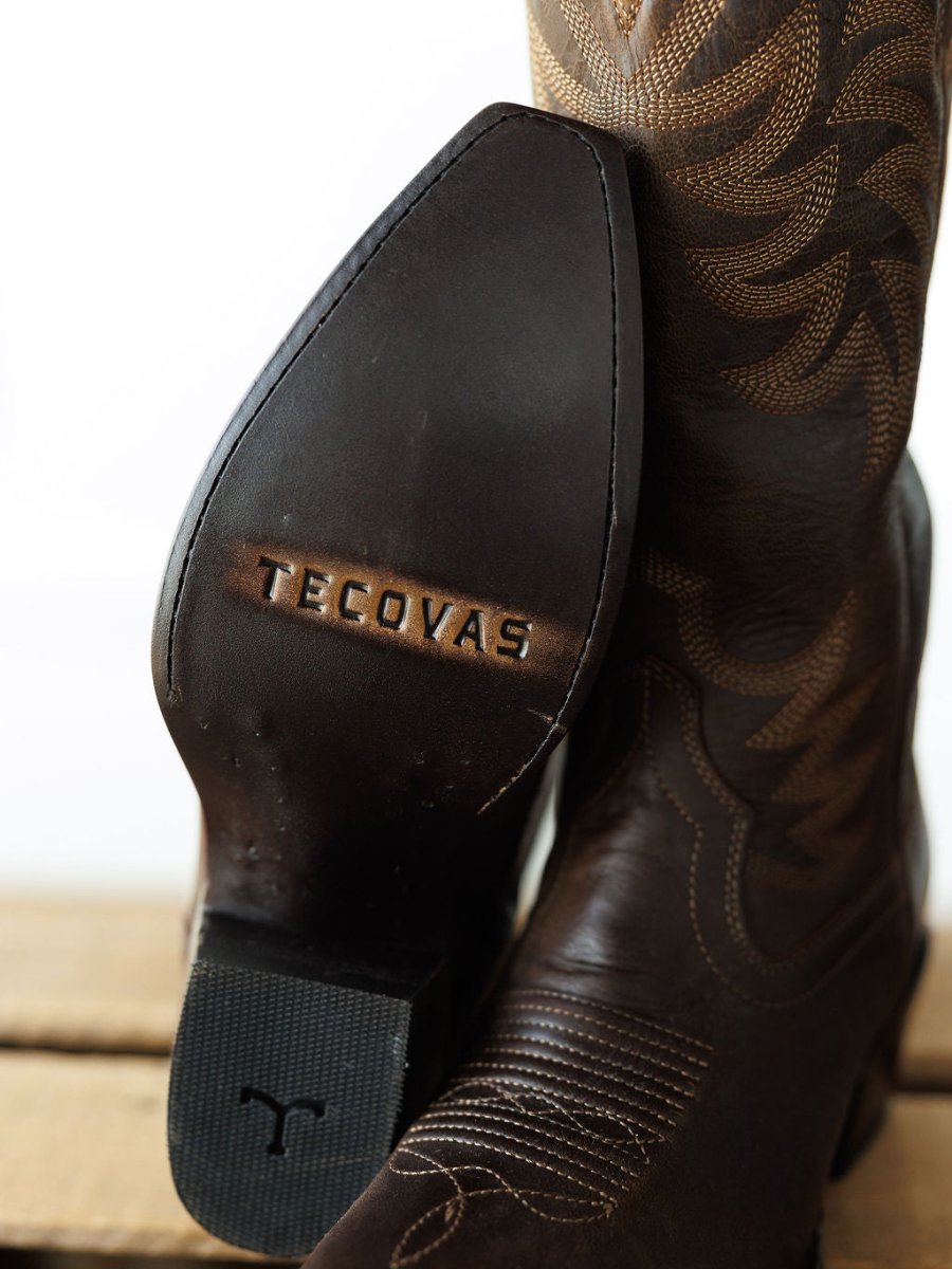 Close-up of The Annie Boot {Cafe} by Savannah Sevens western life{&}style. Crafted in brown premium goat leather with a snip toe, embossed sole branding, and decorative upper stitching. Boots handmade by Tecovas.
