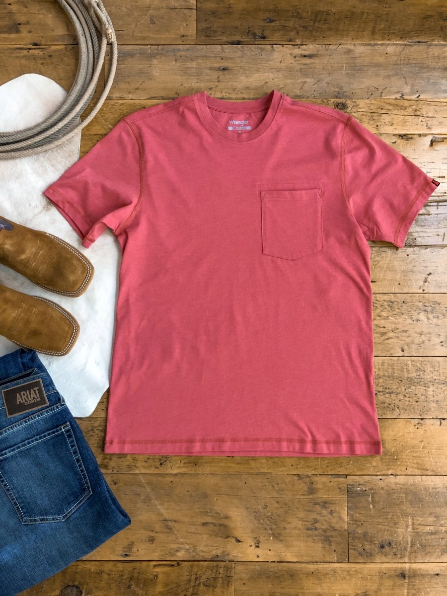 The Carver Men's XL performance tee by Savannah Sevens western life&style is laid flat on a wooden floor with blue jeans, brown cowboy boots, a white cloth, and coiled rope. This short sleeve shirt features a chest pocket and moisture management.