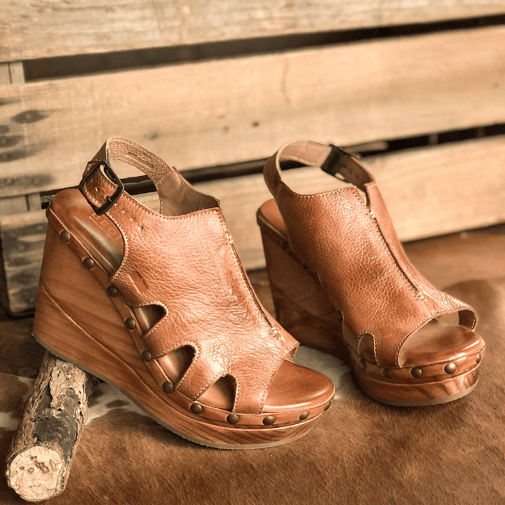 The Pate (8.5) tan dip dye leather wedge sandals with peep toes, ankle straps, and studded wood grain wedges.