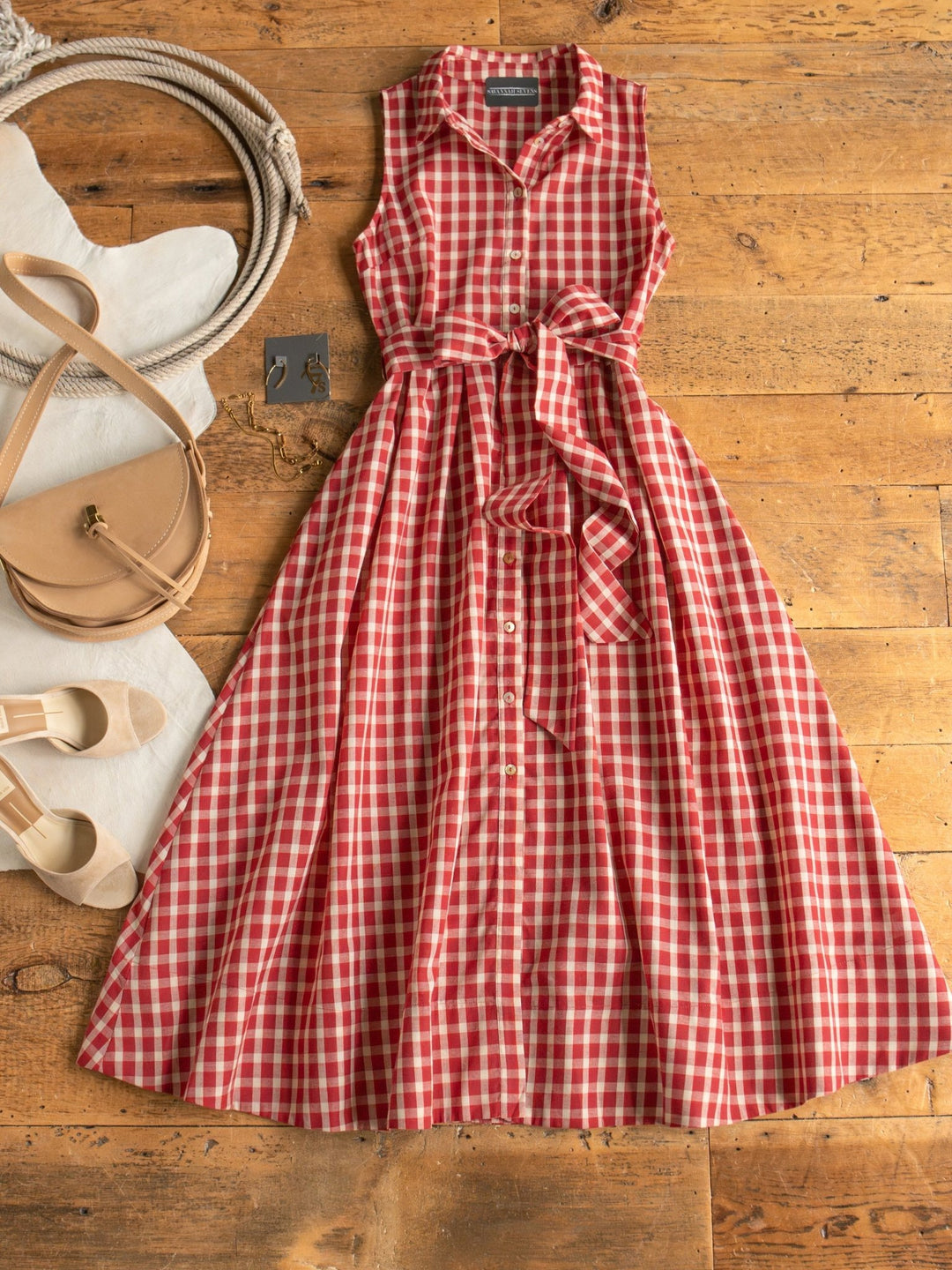 red gingham midi dress Leona Our Hazel Dress in Red features an allover gingham print and a flattering midi silhouette for comfortable all Red Gingham Pink Trim Midi