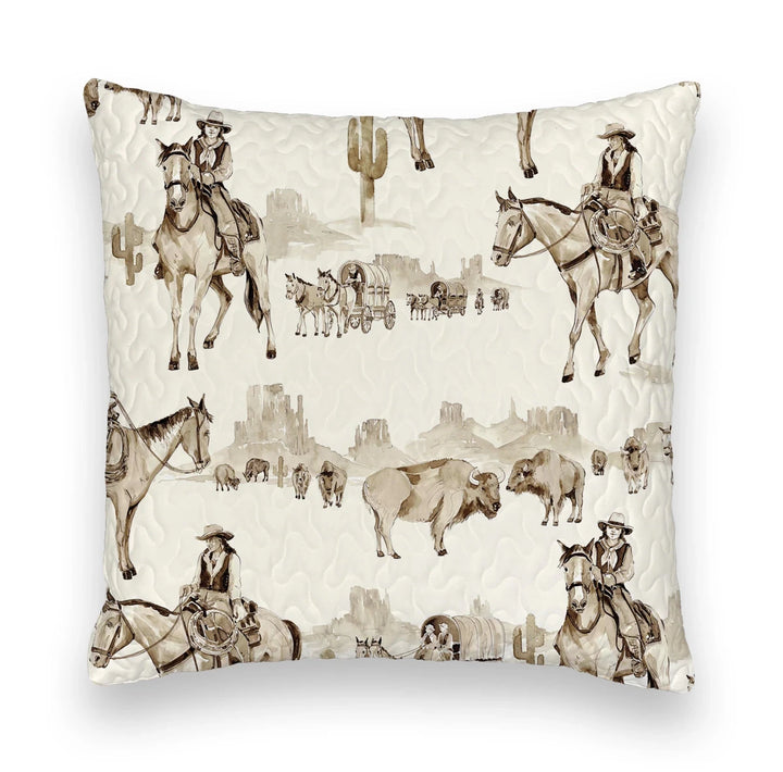 The Vaquera Quilt & Shams by Savannah Sevens western life{&}style features a cream background with sepia western prints—cowboys, bison, cacti, wagons—in 100% cotton and a quilted texture inspired by handmade quilts.
