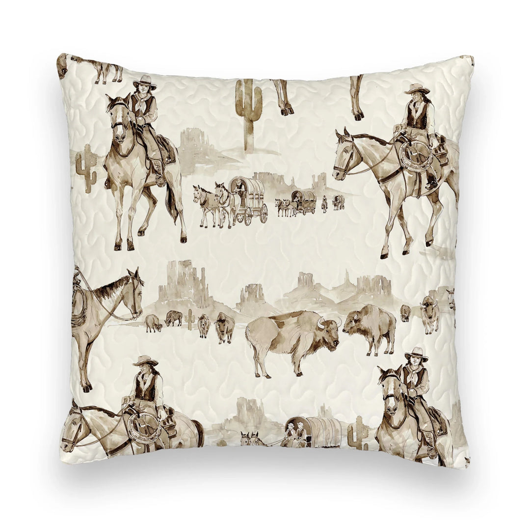 The Vaquera Quilt & Shams by Savannah Sevens western life{&}style features a cream background with sepia western prints—cowboys, bison, cacti, wagons—in 100% cotton and a quilted texture inspired by handmade quilts.