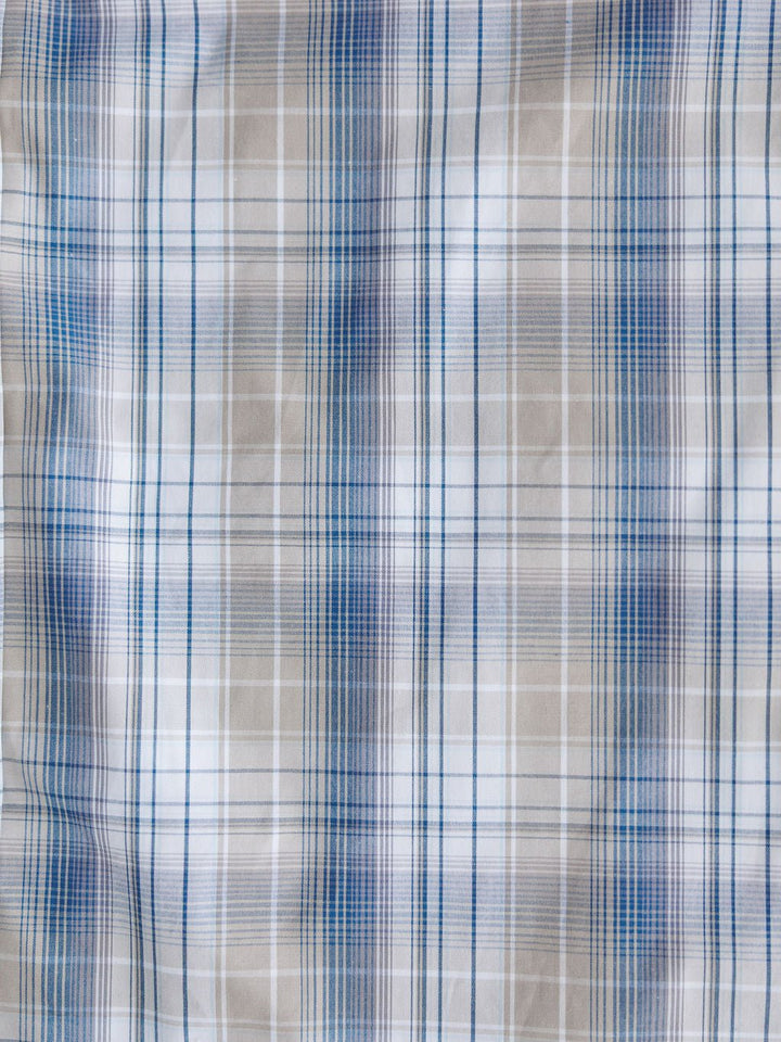 The Wesson Ariat Men's Plaid Button Up by Savannah Sevens western life{&}style features intersecting blue, white, and beige lines in a soft plaid design with moisture-wicking fabric for all-day comfort.