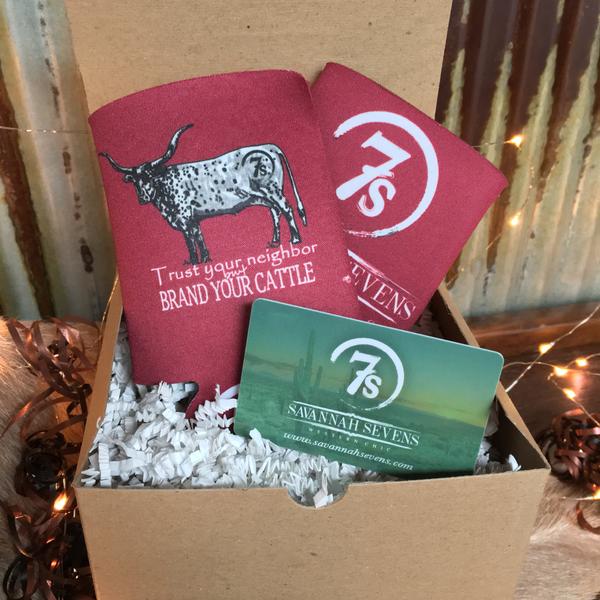 This gift box includes two cranberry Brand Your Cattle Koozies from Savannah Sevens western life{&}style and a green gift card, all nestled in white shredded paper for a Western Chic presentation.